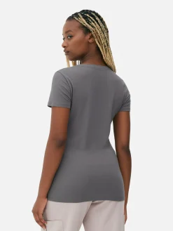 Camiseta Elástica De Manga Corta Y Cuello Redondo