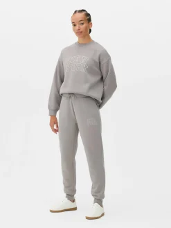 Pantalones De Chándal Pitillo Con Estampado Gráfico