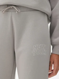 Pantalones De Chándal Pitillo Con Estampado Gráfico