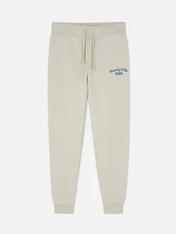 Pantalones De Chándal Pitillo Con Estampado Gráfico