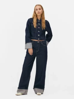 Vaqueros De Pernera Ancha Con Bajos Vueltos