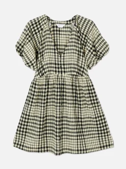 Vestido Con Vuelo, Cuello De Pico Y Mangas Abullonadas